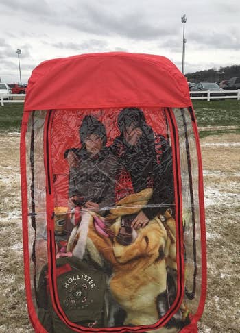 two people in a red weather pod
