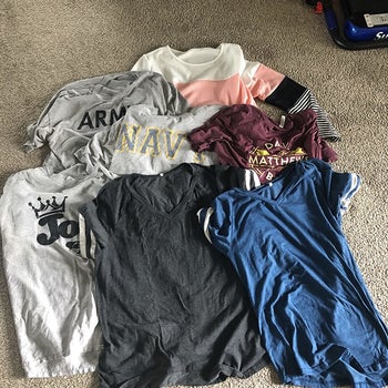 a reviewer photo of seven different shirts