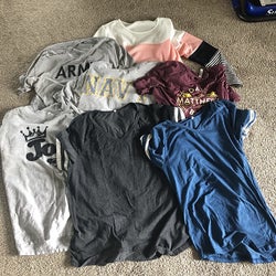 a reviewer photo of seven different shirts