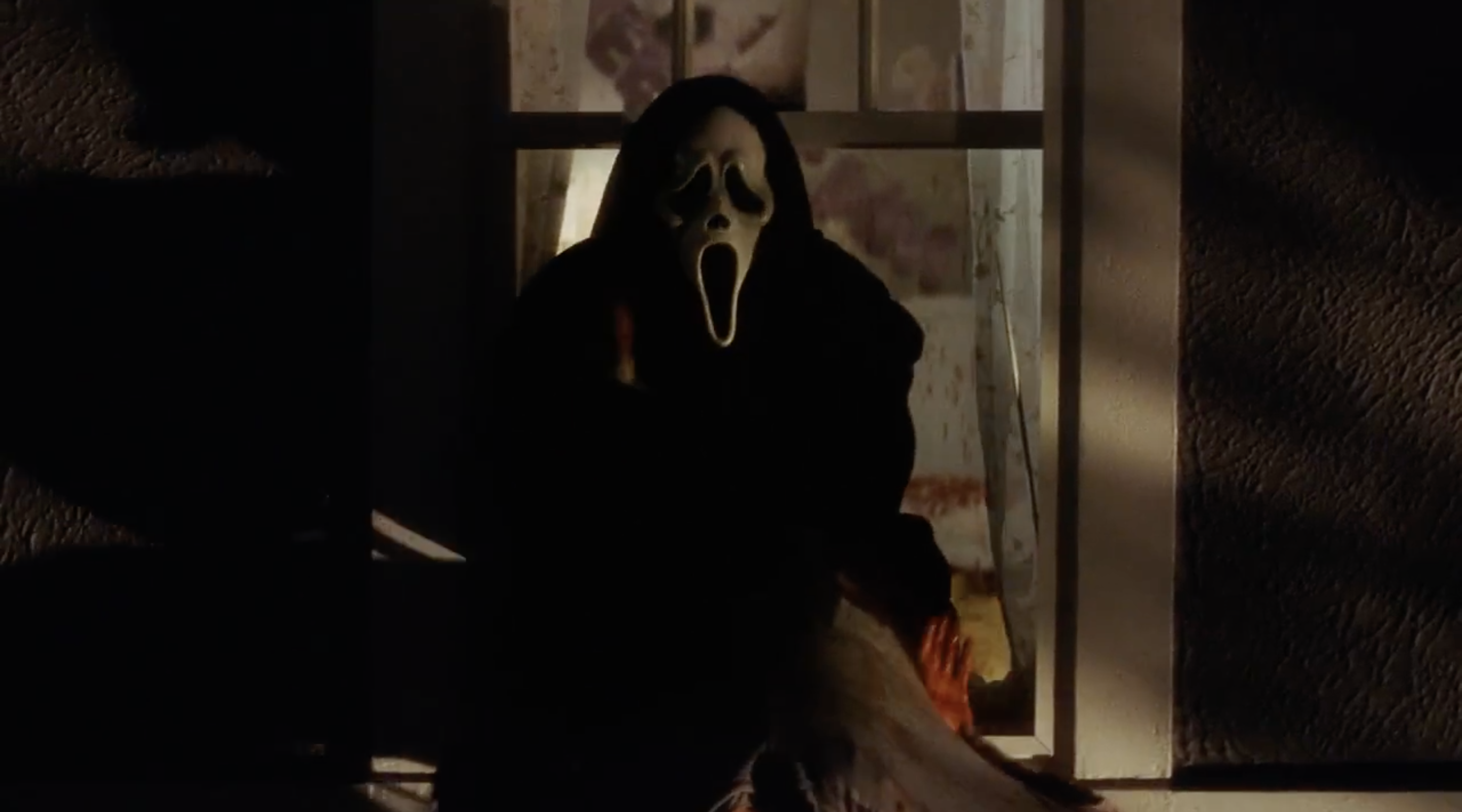 Ghostface hangs Marielle Jaffe out a window