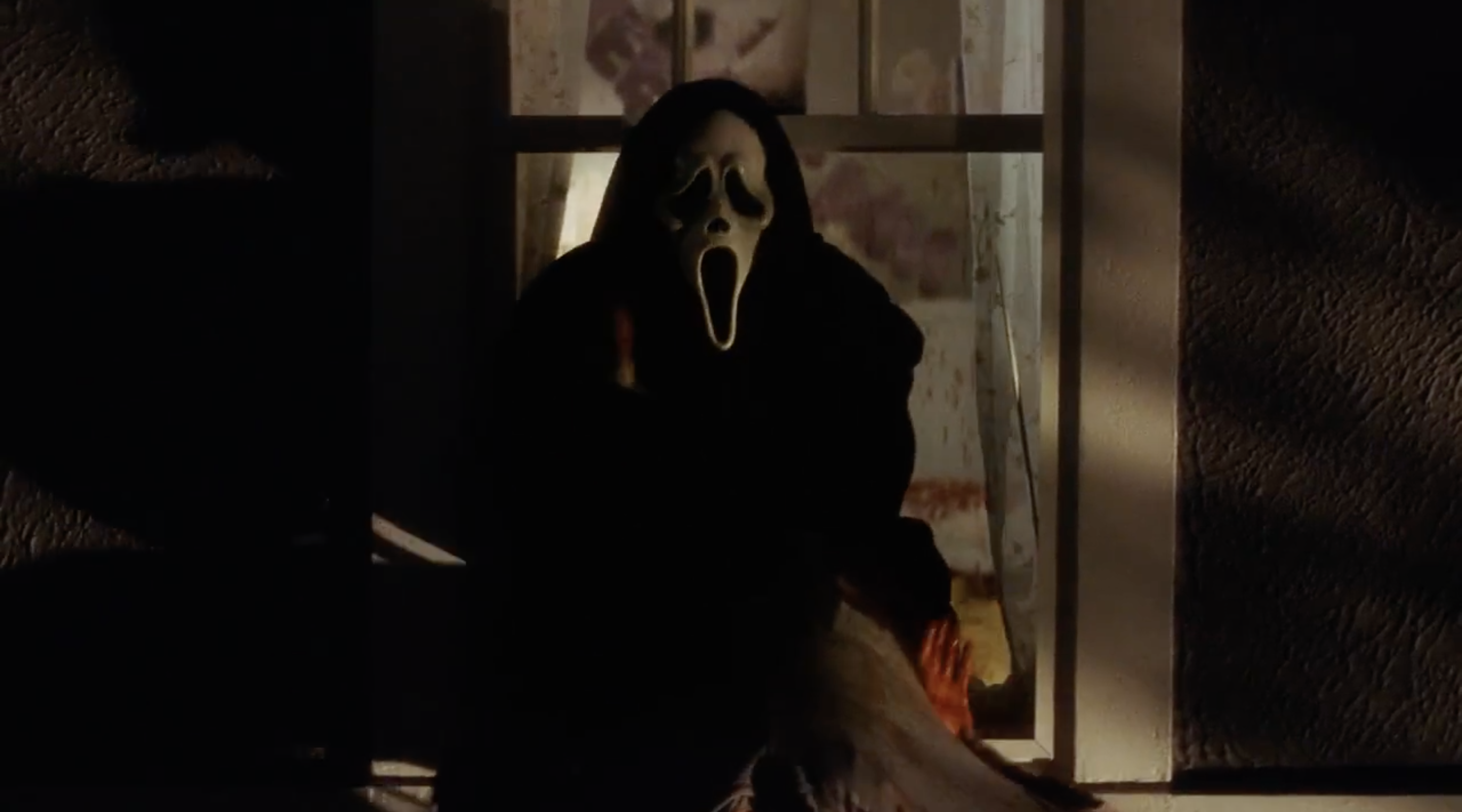Ghostface hangs Marielle Jaffe out a window