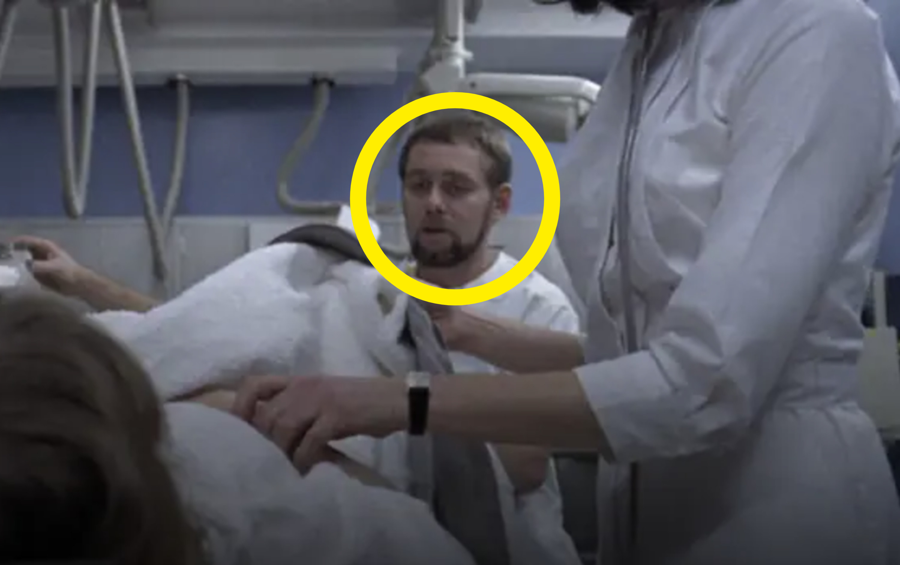 A man&#x27;s face circled in a hospital scene