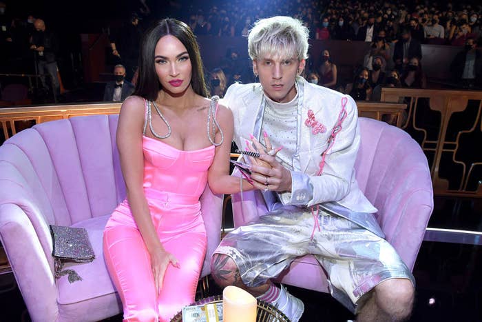 Megan Fox and Machine Gun Kelly posing for a picture at an awards show
