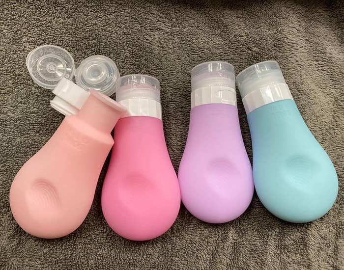 Reviewer photo of four multicolored squeeze bottles
