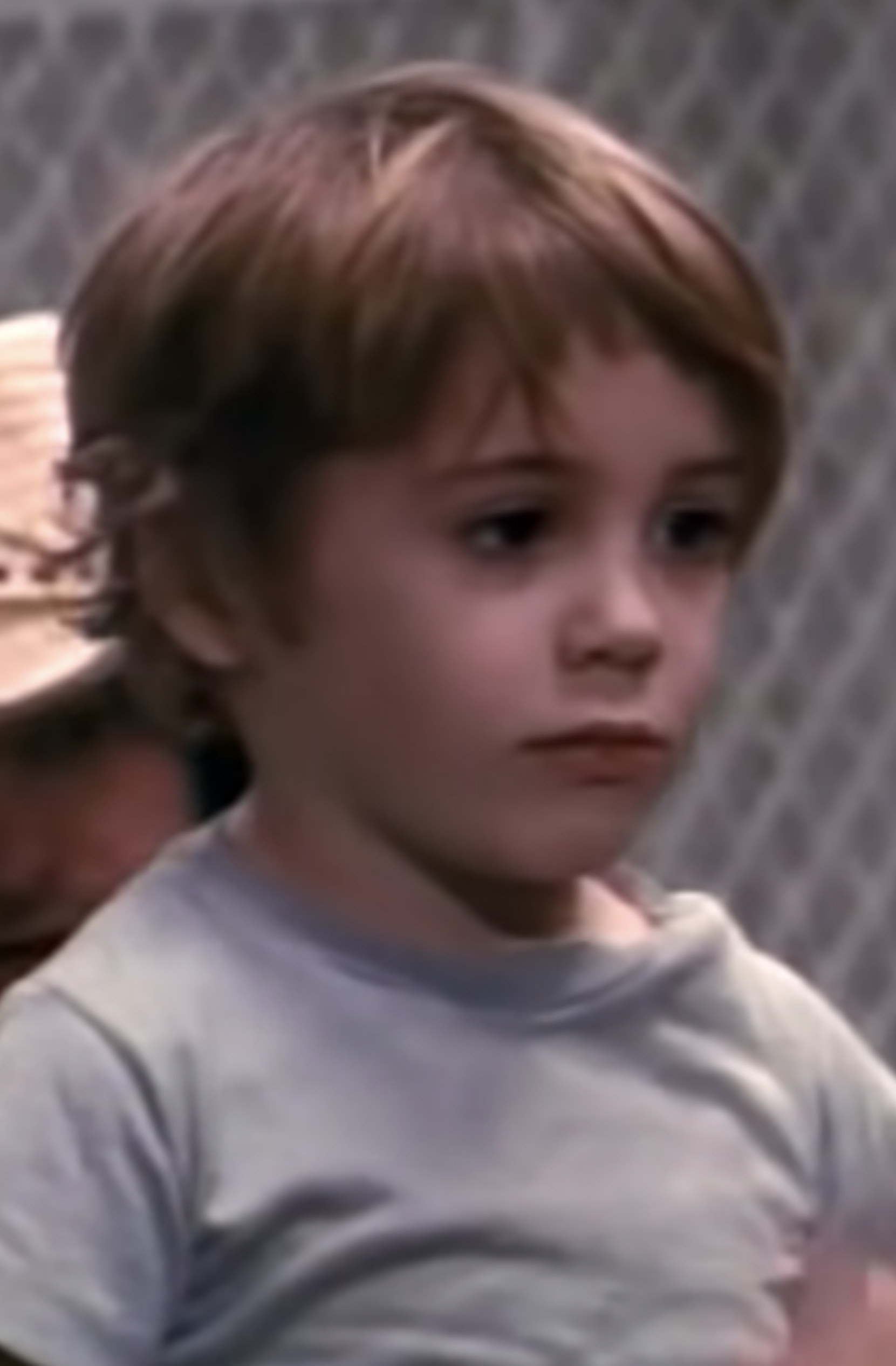 Young Robert Downey Jr. as a kid talking to someone in a jail cell