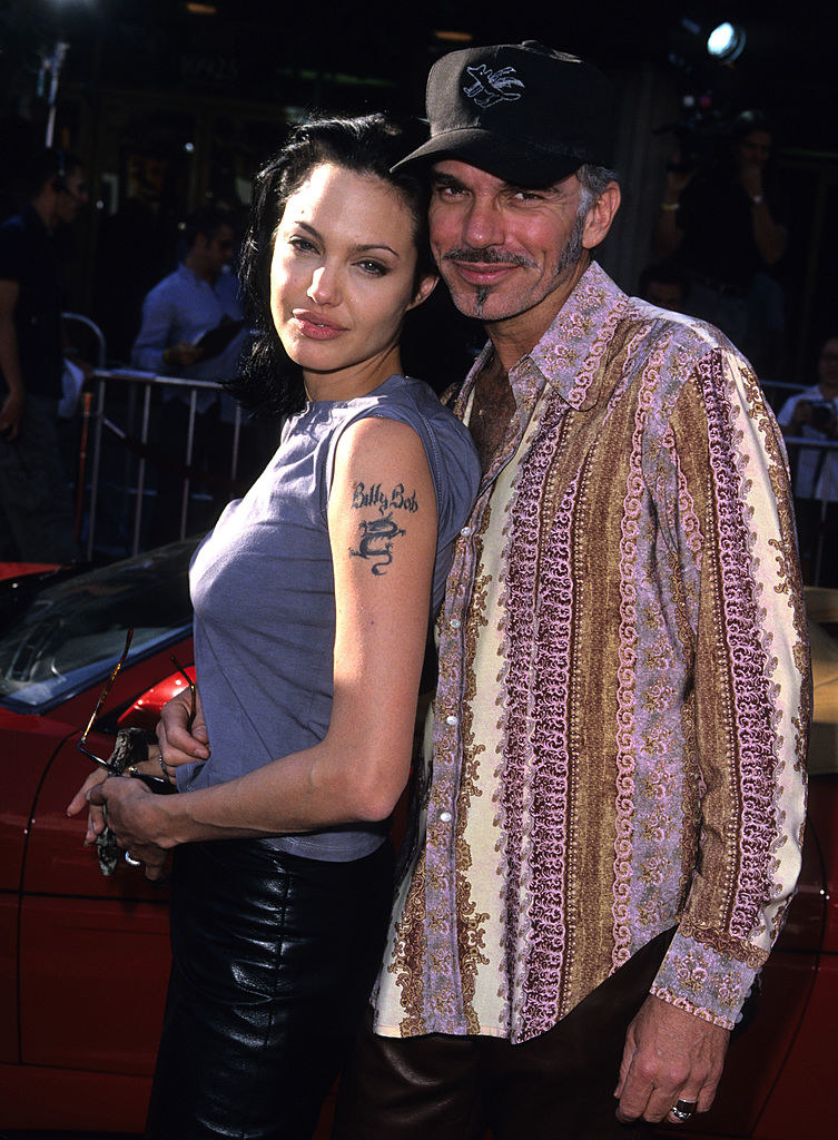 Angelina Jolie and Billy Bob Thornton posing together on a red carpet