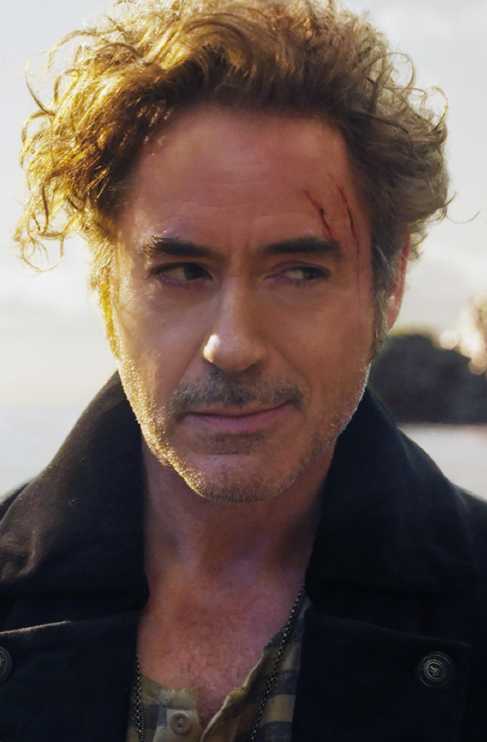 Downey Jr. on a ship with two scars on his face