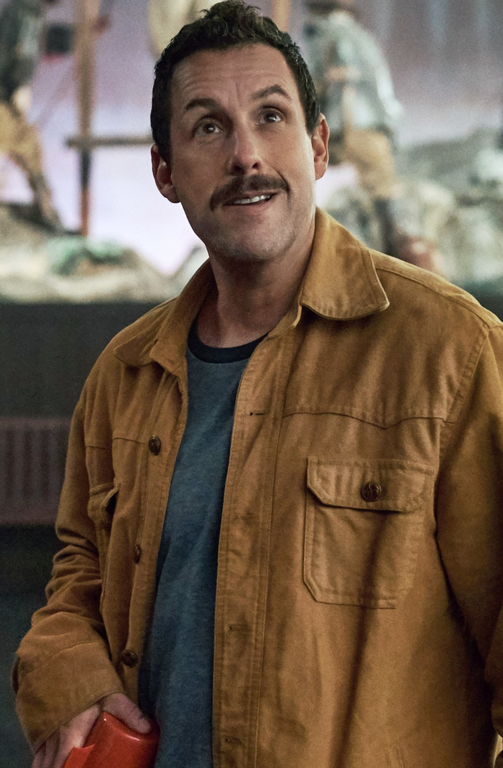 Sandler with a mustache, watching something mysterious on Halloween night