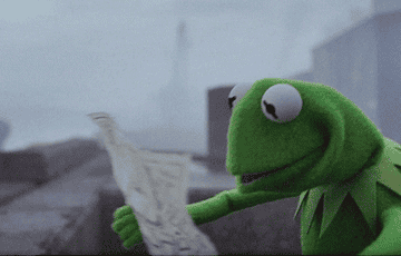 Kermit the Frog worried and looking at a map