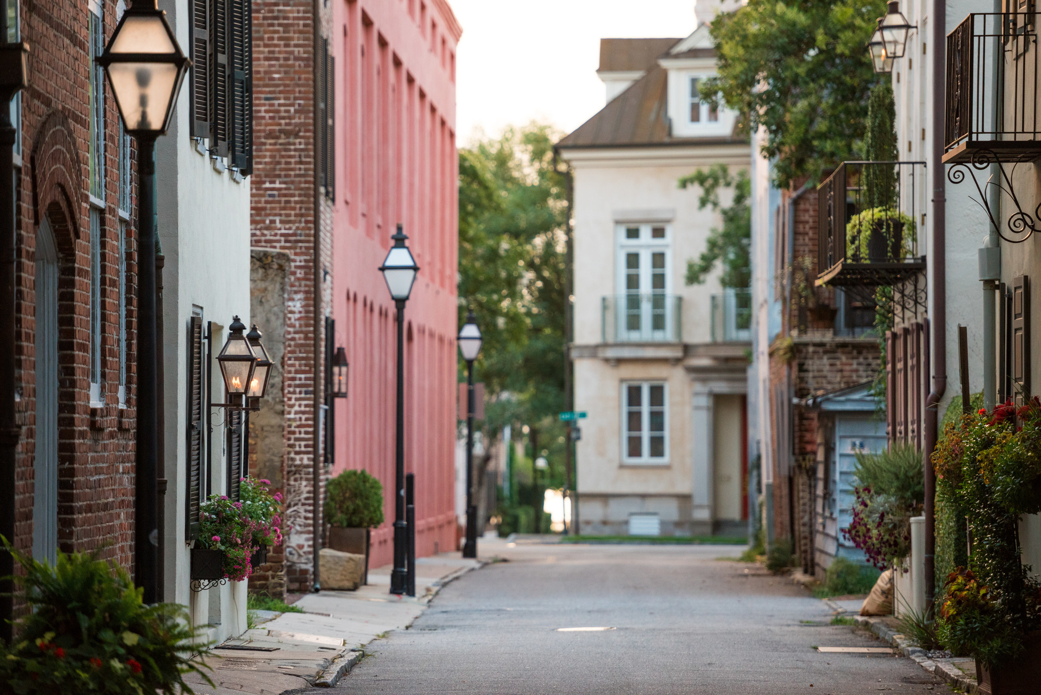 A historic city street with old, colorful houses.