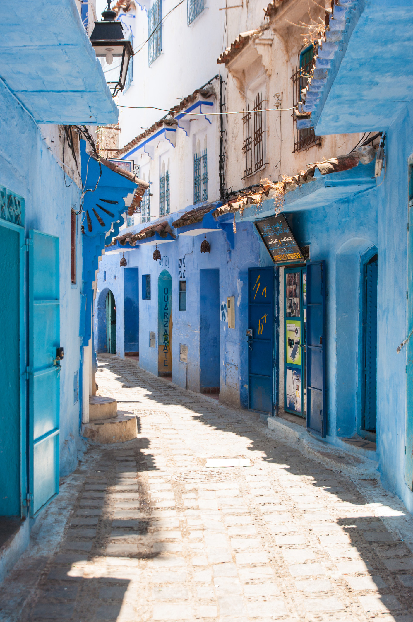 A street with blue painted houses.