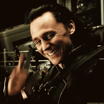 Tom Hiddleston giving a thumbs up as Loki