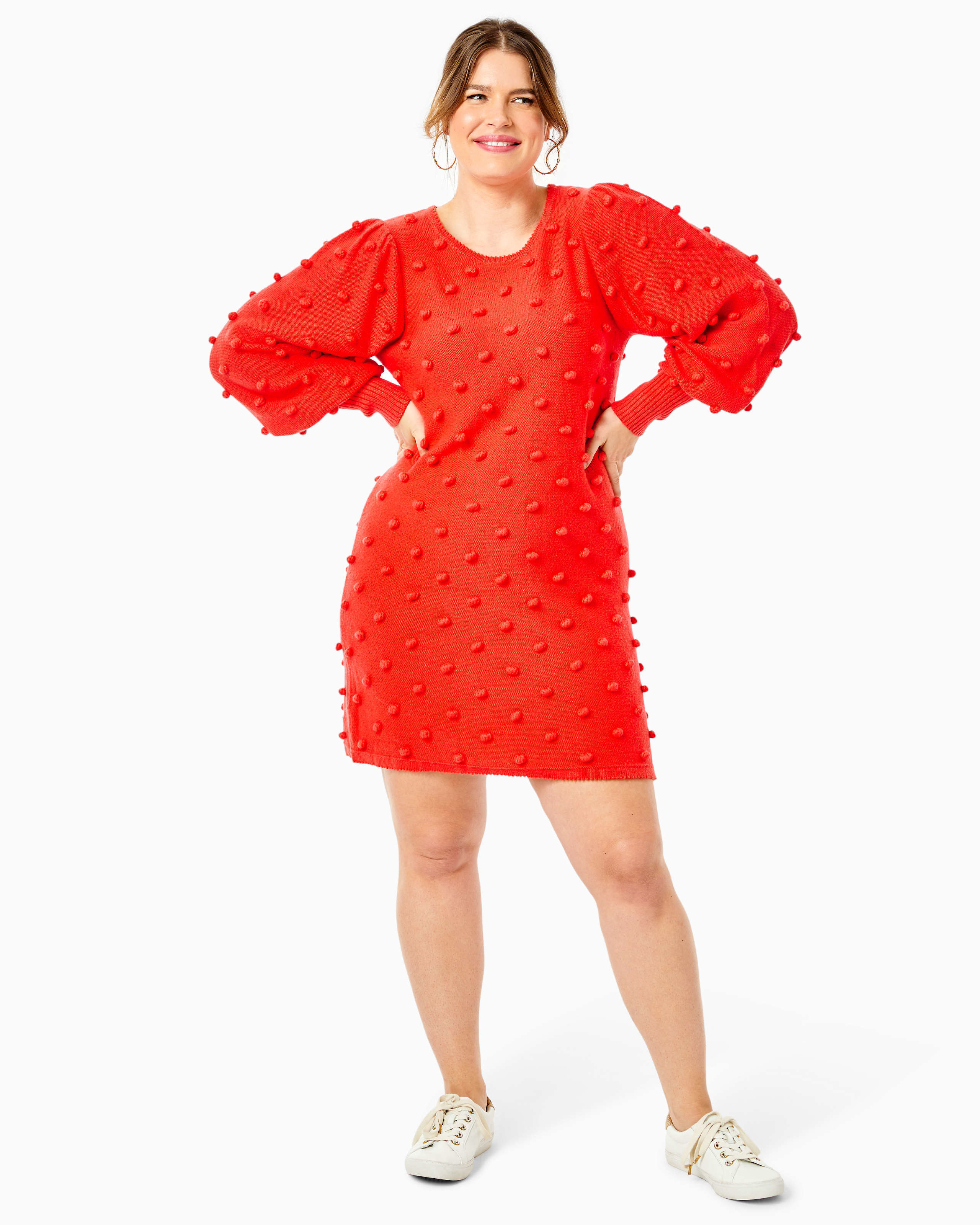 model wearing the ruby red polka dot pom dress