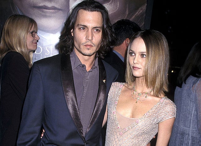 Johnny Depp and Vanessa Paradis posing on a red carpet