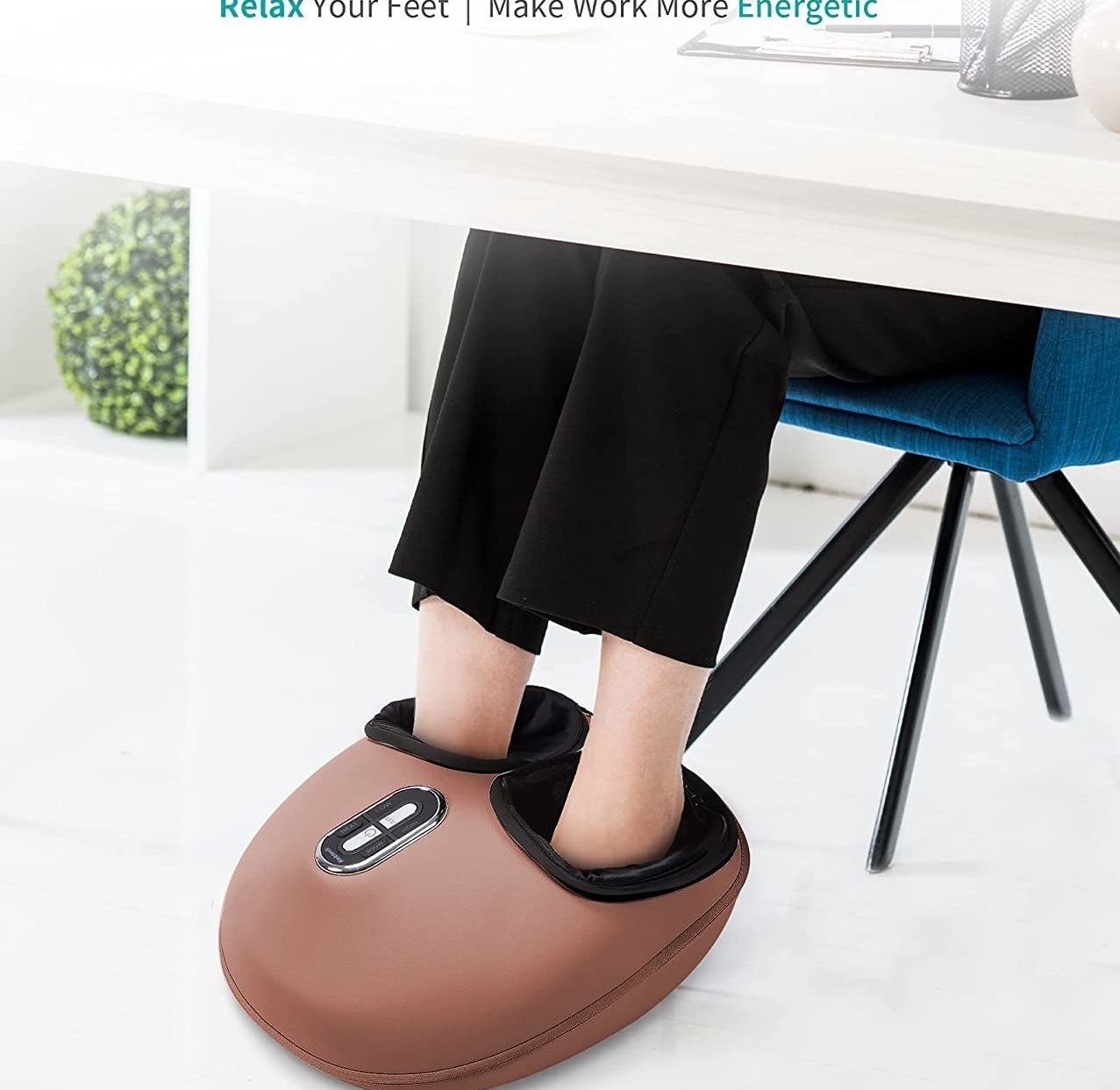 A person with their feet in an electronic foot massager