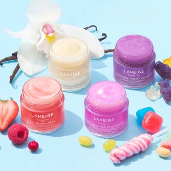 the lip masks in all four scents surrounded by candy and fruit