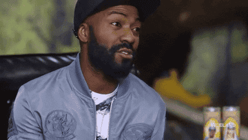 Desus Nice widens his mouth before leaning back into the chair that he sits in in &quot;Desus &amp; Mero&quot;