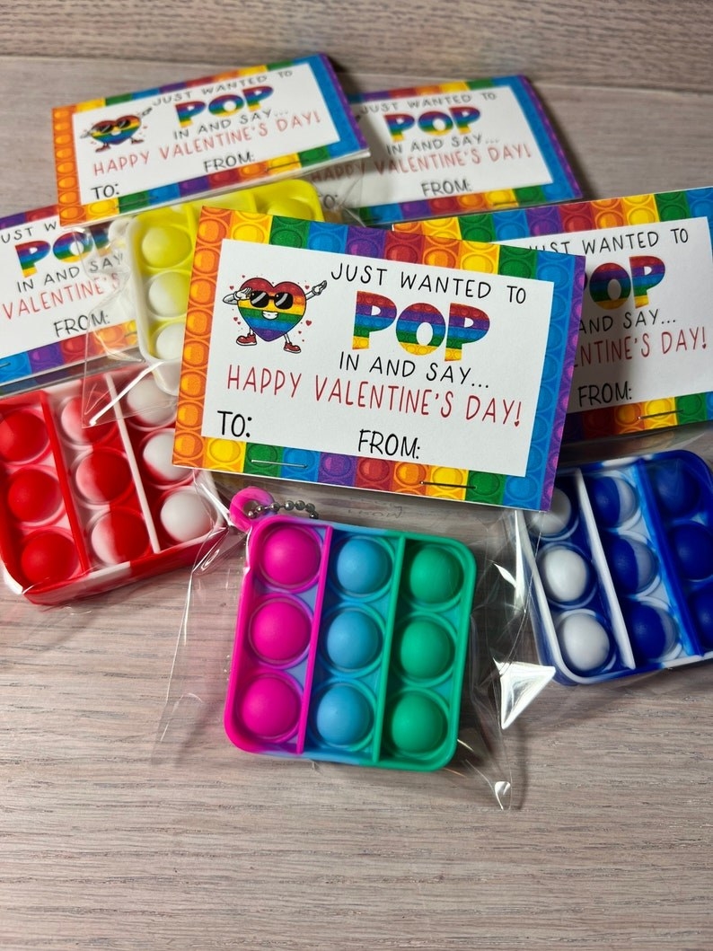 Colorful pop it keychains packaged inside clear bags with tags featuring the words &quot;Just wanted to pop in and say...Happy Valentine&#x27;s Day&quot;