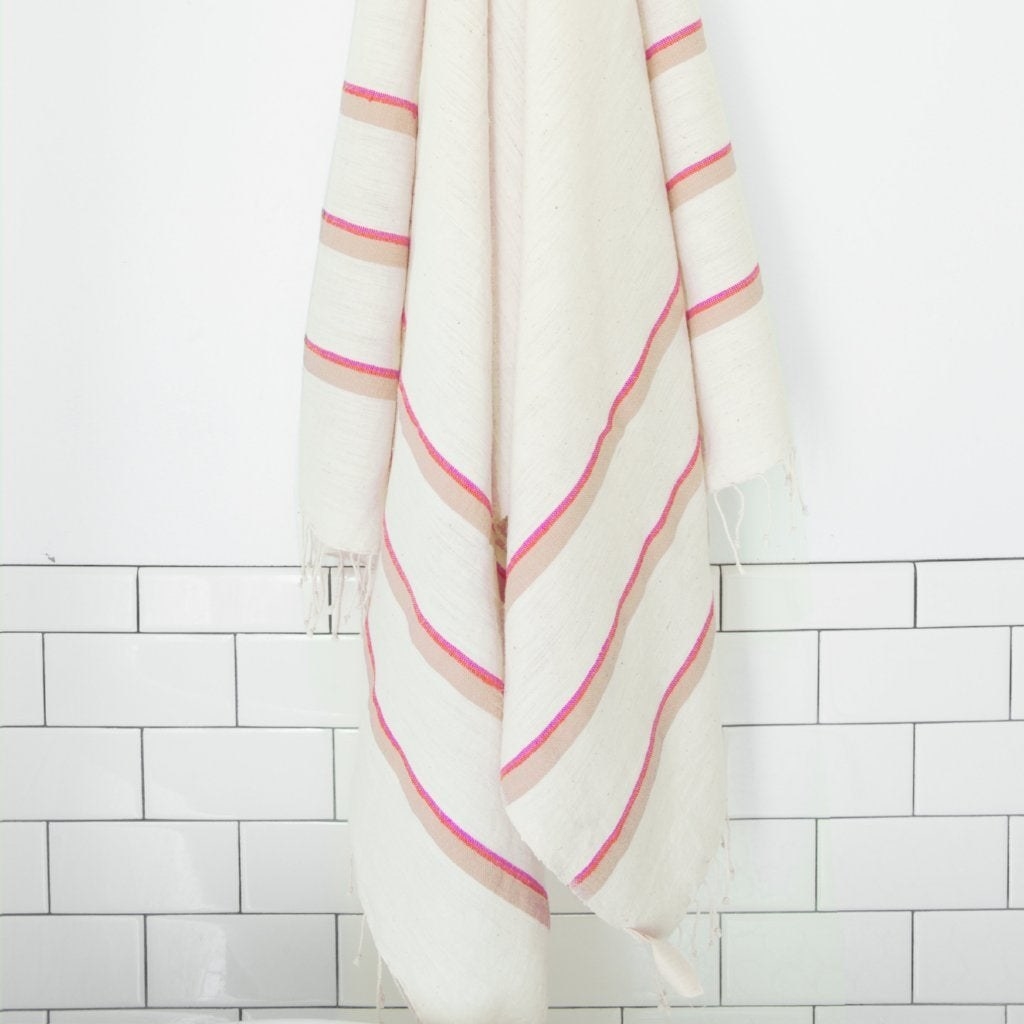 white towel with blue and beige stripes