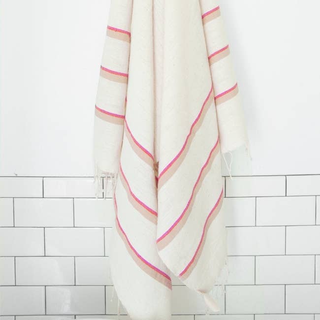 white towel with blue and beige stripes