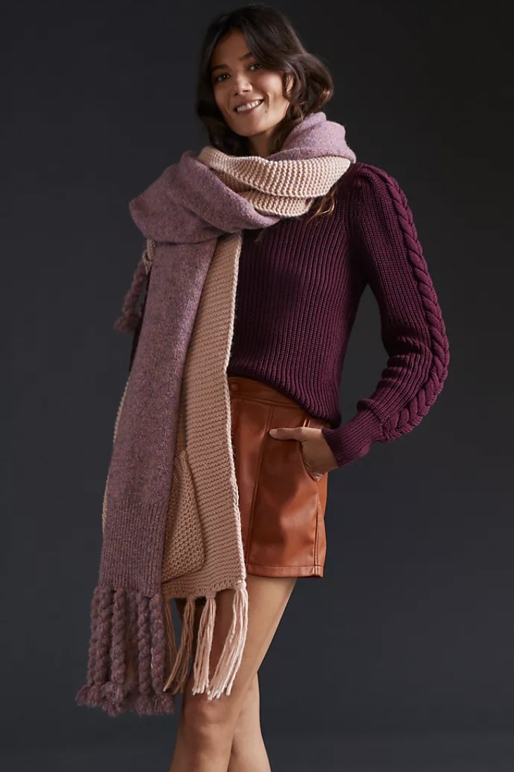 model wearing the long scarf with fringe details