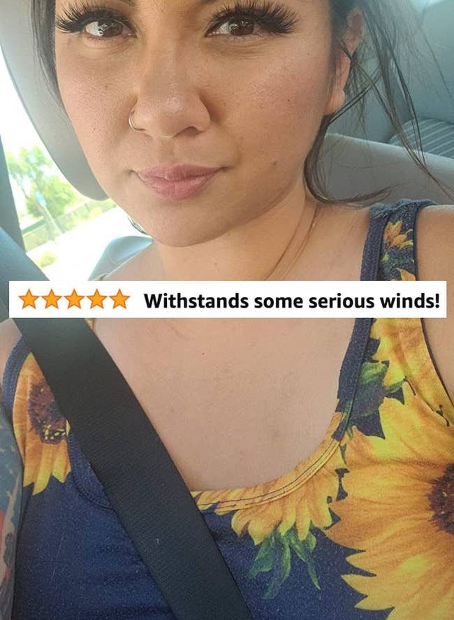 A reviewer wearing false eyelashes and review text 