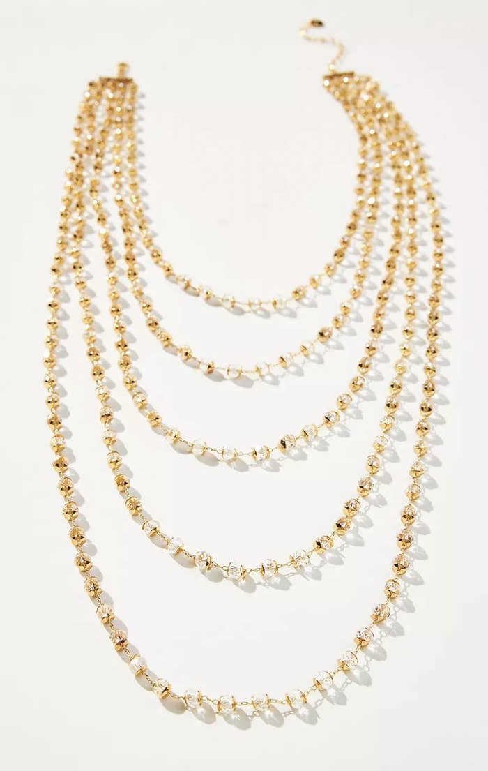 the necklace with five layers of gold and crystal necklaces
