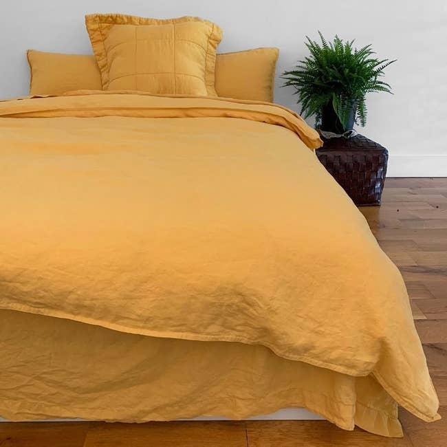 yellow linen sheets on a bed