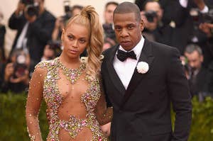 image of beyonce and jay-z at met gala in 2015 where beyonce is wearing a bedazzled dress and jay-z a suit