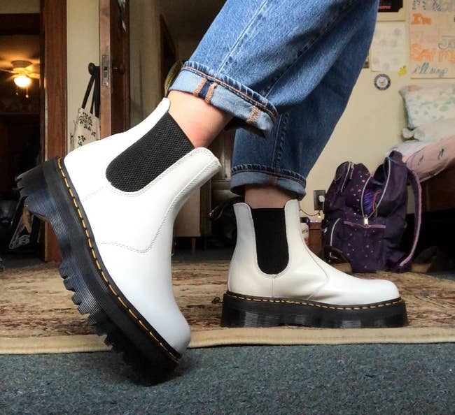 reviewer wearing the white platform sole boots