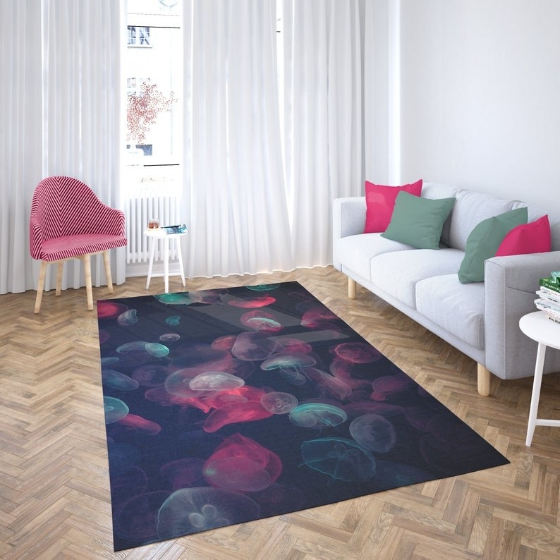 the black rug with translucent pink, blue, and white jellyfish