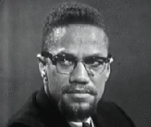 Malcolm X smiles