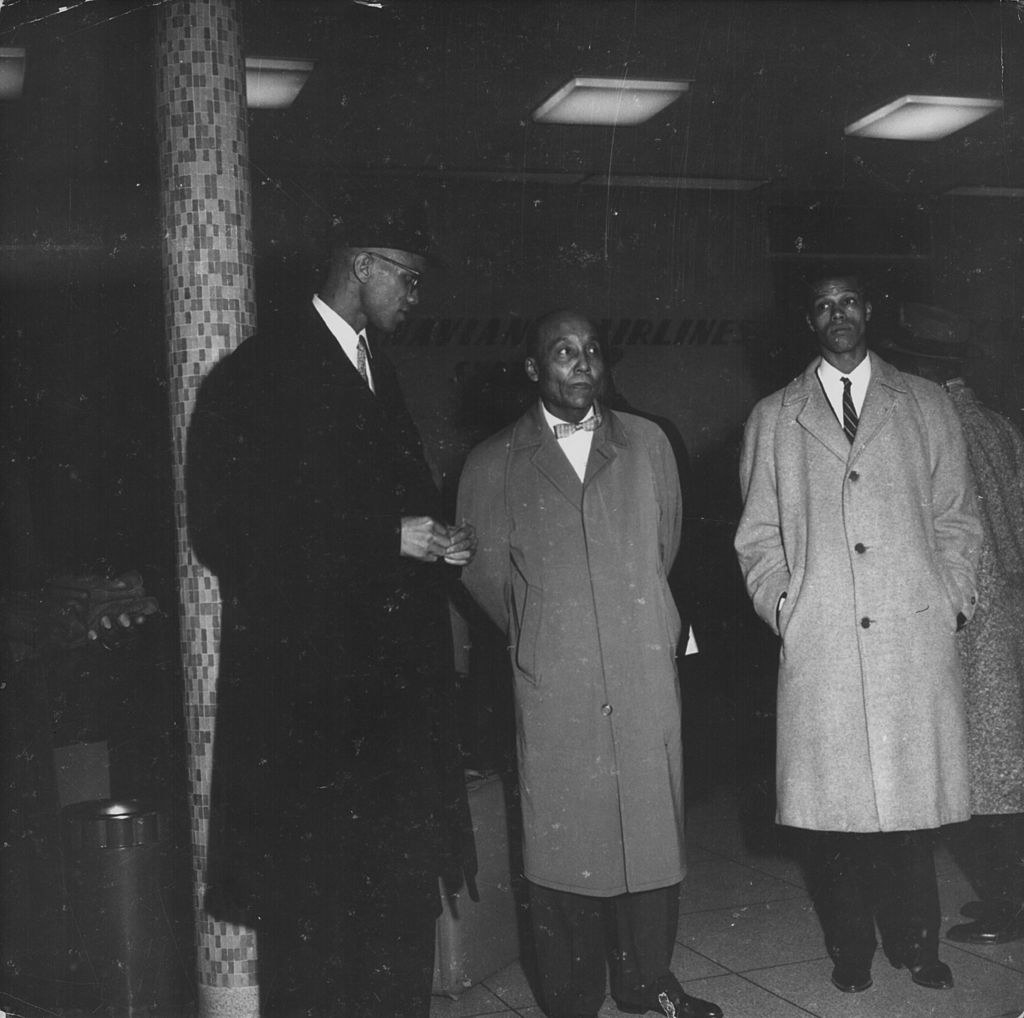 Human rights activist Malcolm X, with political leaders Elijah Muhammad and Louis Farrakhan