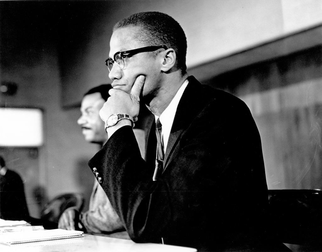Civil rights leader Malcolm X attends a meeting