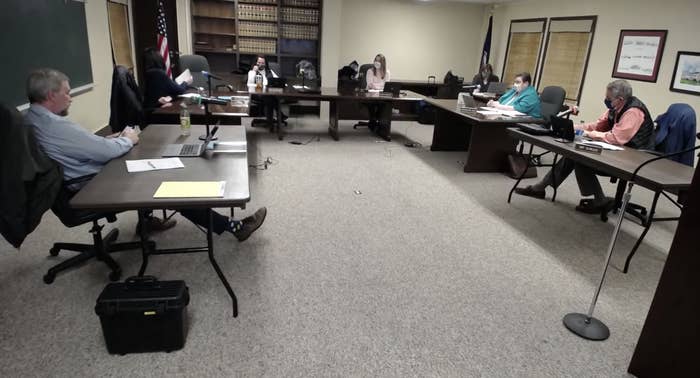 Screenshot from Page County School Board meeting Jan. 20, showing men and women gathered in a horseshoe arrangement of tables