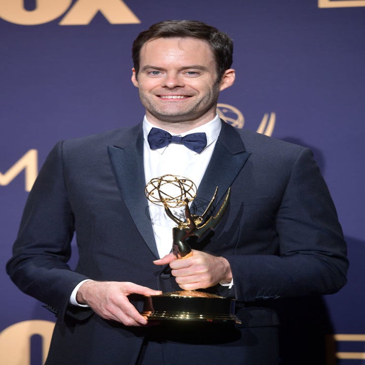 Bill holding his Emmy on the red carpet