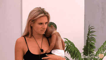 Love Island UK: Chloe is seen holding a baby with a look of annoyance