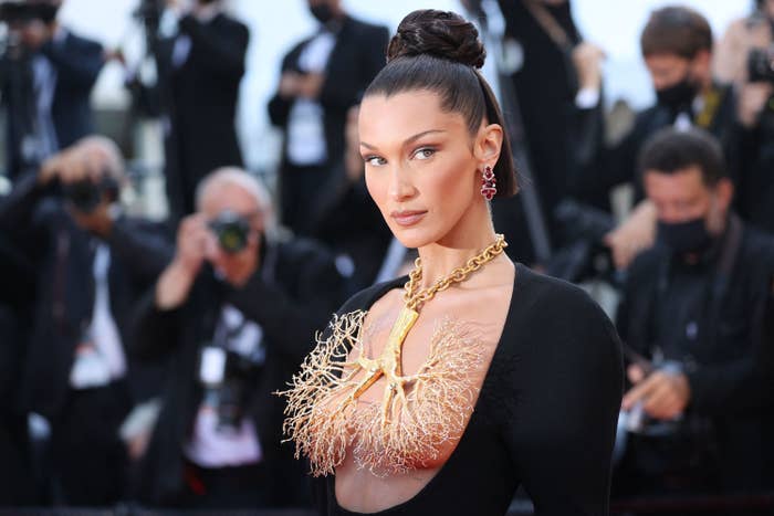 Bella at the Cannes Film festival in a long gown with a 3-D chest plate