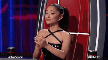 Ariana. applauding tearfully on The Voice