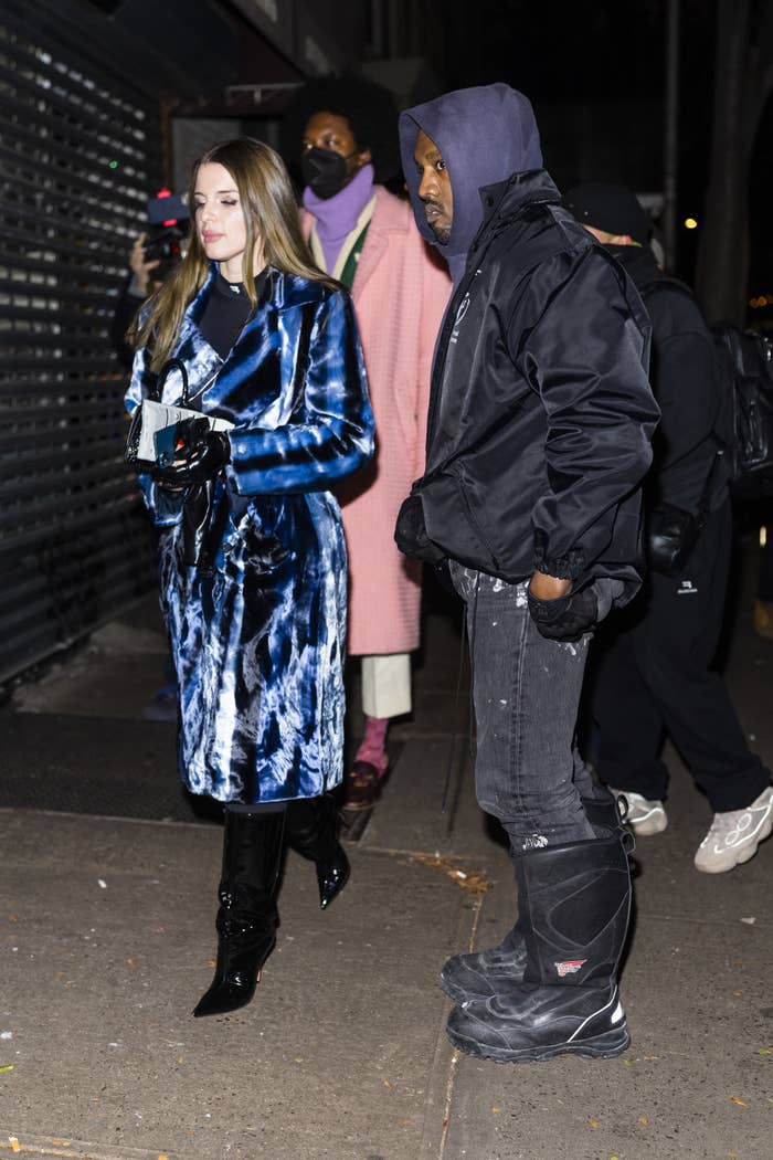 Kanye and Julia walk outside