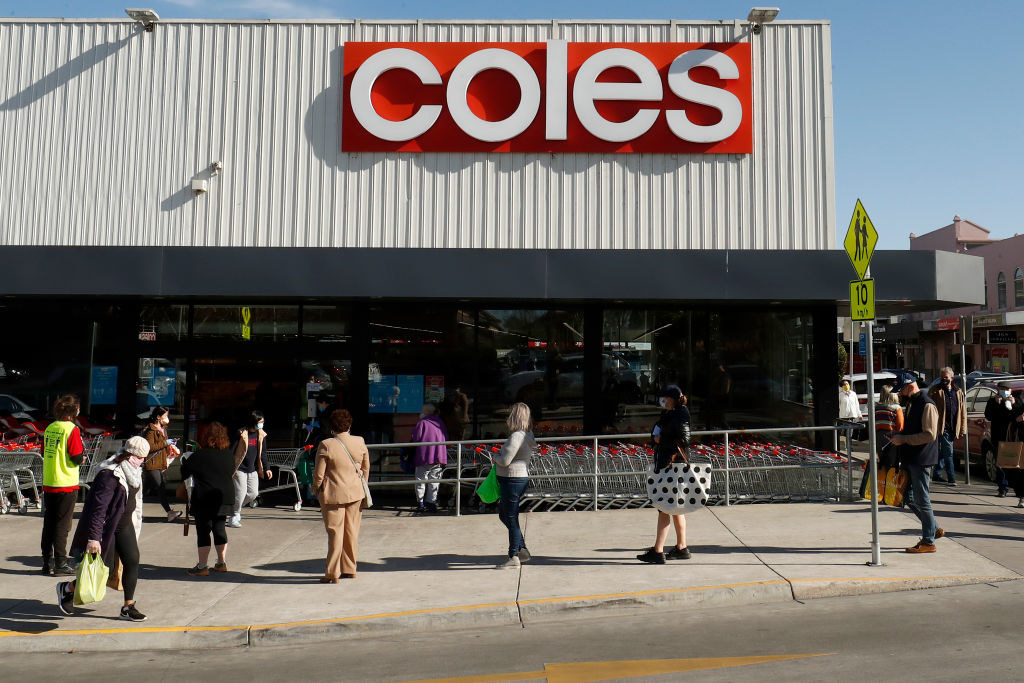 People line up outside a Coles supermarket