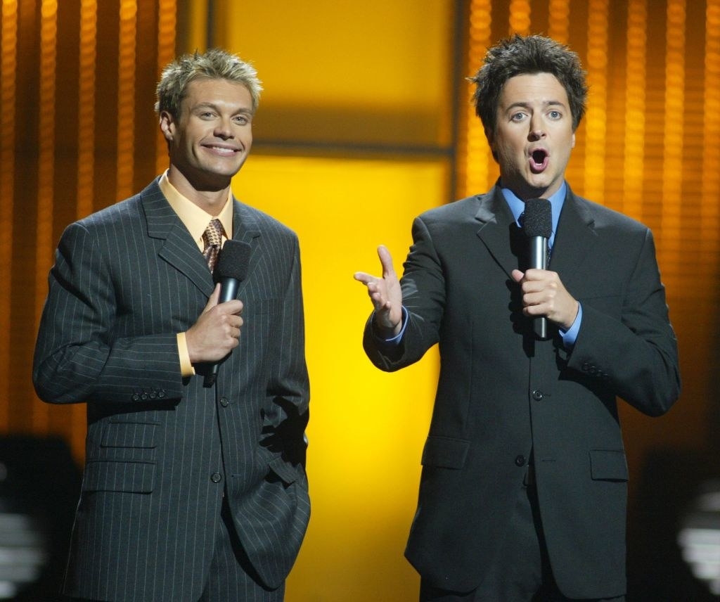 ryan and brian in pin stripe suits hosting idol