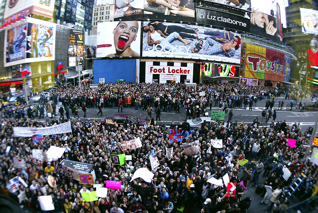 a crowd of people take over times square