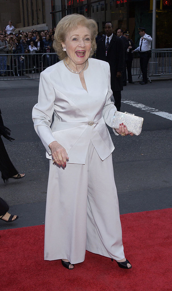 betty white is wearing a white pantsuit