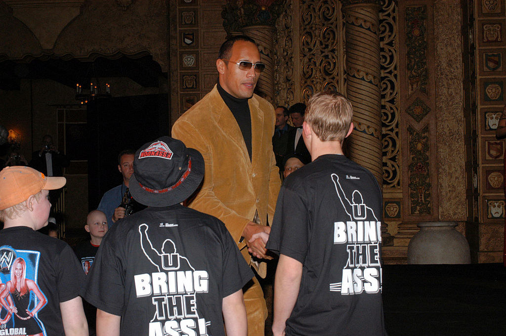 kids and the rock and their weird shirts