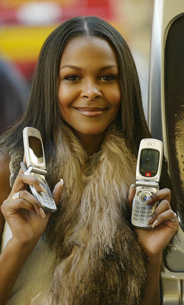 samantha mumba with 2 flip phones