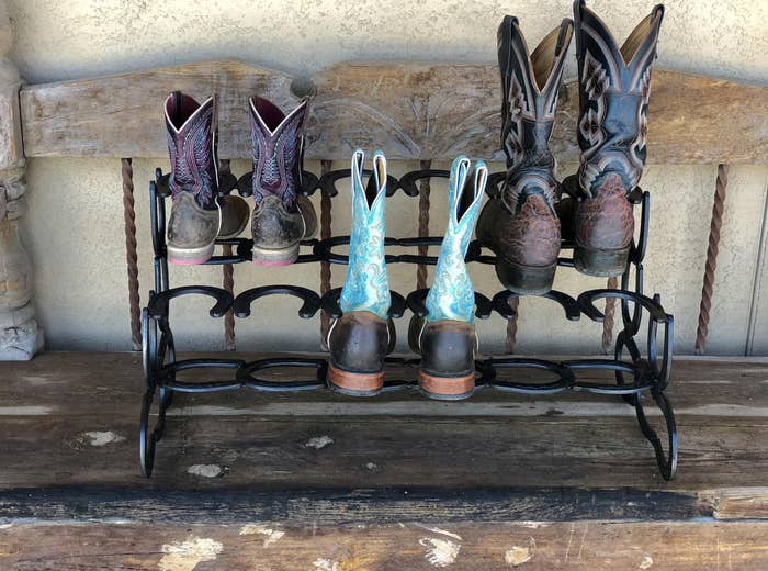 Three pairs of boots on boot rack