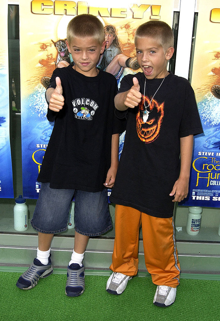 the sprouse twins giving a thumbs up