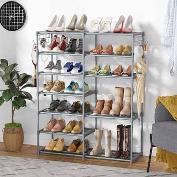 Shoe rack with various shoes and boots placed on shelves