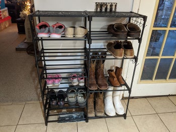 Shoe rack placed in reviewer's home with various shoes inside